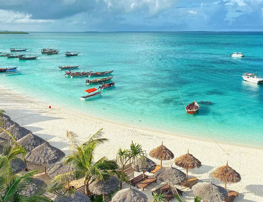 Traditional boats resting on a Zanzibar beach