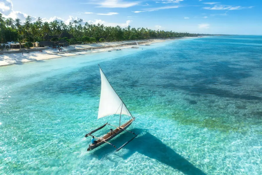 A dhow sailing across the Zanzibar reef